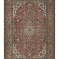Oversized 7.7x11 ft Persian-style wool and cotton rug featuring red and brown floral motifs in a traditional bohemian design.