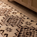 Handmade 2.9x11.2 ft Persian-style wool and cotton runner rug featuring white and brown geometric patterns.