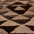 Handmade wool and cotton Persian-style runner rug featuring a white and brown geometric triangle pattern.