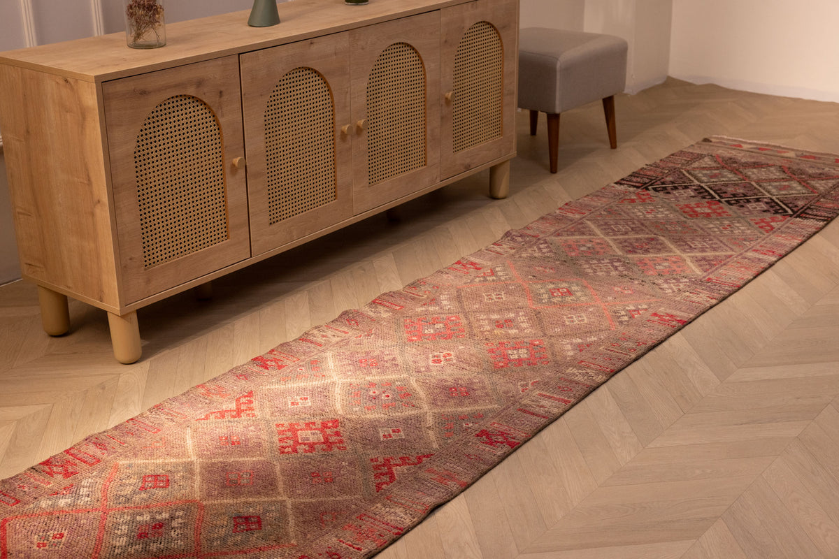 Handmade 2.7x13.2 ft brown wool and cotton Persian-style runner rug with geometric Bohemian patterns.