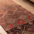 Handmade 2.7x13.2 ft brown wool and cotton runner rug featuring a geometric, maximalist Persian-style pattern.