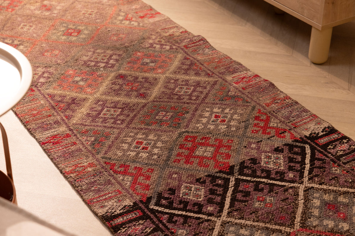 Handmade 2.7x13.2 ft brown wool and cotton runner rug featuring a geometric, maximalist Persian-style pattern.