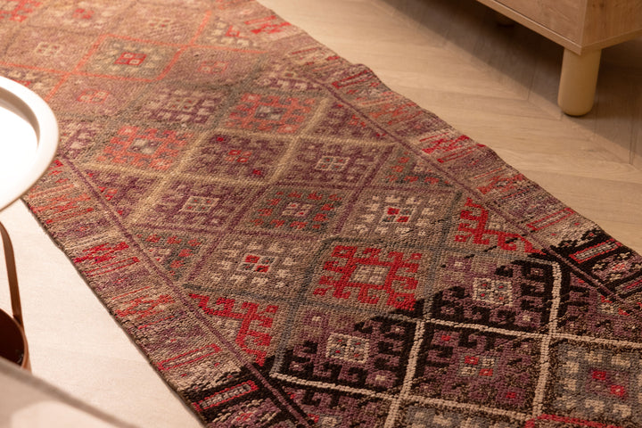 Handmade 2.7x13.2 ft brown wool and cotton runner rug featuring a geometric, maximalist Persian-style pattern.