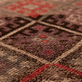 Handmade brown wool and cotton runner rug featuring a geometric, bohemian-style maximalist pattern.