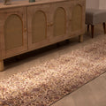 Vintage Isparta wool and cotton runner rug with white and beige floral patterns in a farmhouse hallway.