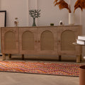 Handmade 3x11 ft wool and cotton Persian-style kilim runner with pink and orange geometric patterns on a wooden floor.