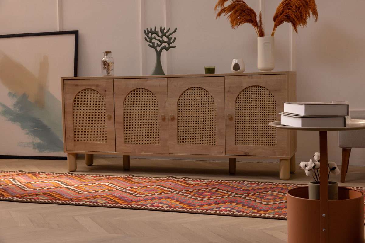 Handmade 3x11 ft wool and cotton Persian-style kilim runner with pink and orange geometric patterns on a wooden floor.