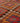 Handmade pink and orange wool-cotton kilim runner with traditional geometric patterns in a flatweave texture.