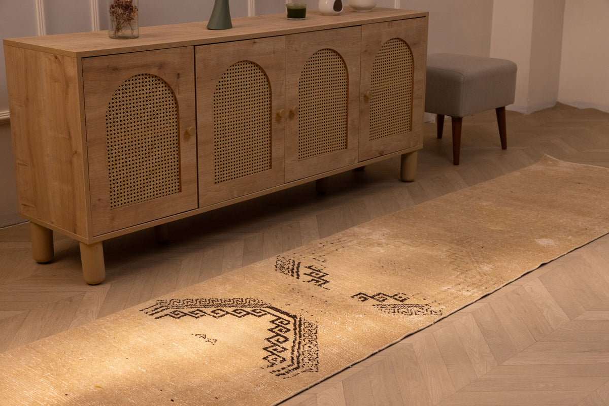 Vintage 2x11 ft beige and brown geometric Turkish wool runner rug in a farmhouse hallway.