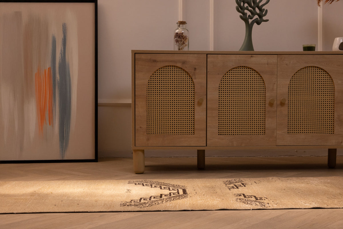 Hand-woven 2x11 ft vintage Turkish runner rug in beige and brown wool with geometric patterns on a wooden floor.