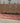 Bohemian 3.4x11.3 ft wool and cotton kilim runner with orange and pink geometric patterns.