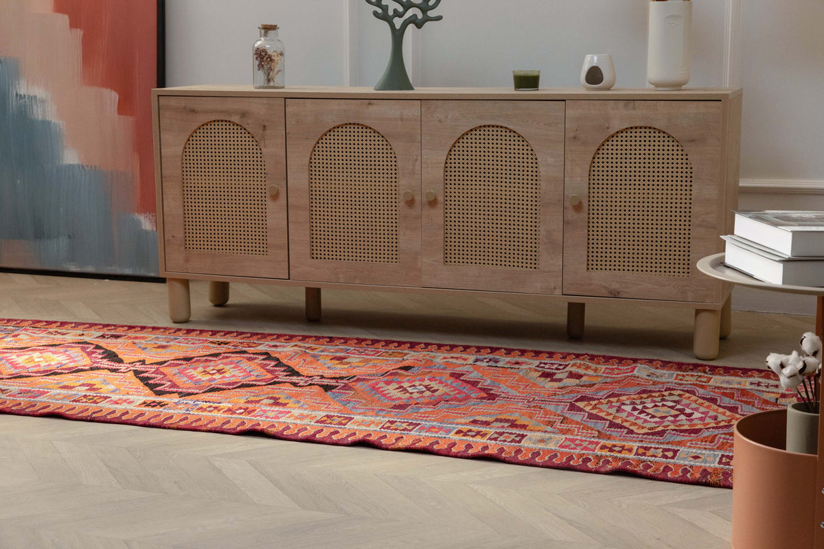 Bohemian 3.4x11.3 ft wool and cotton kilim runner with orange and pink geometric patterns.
