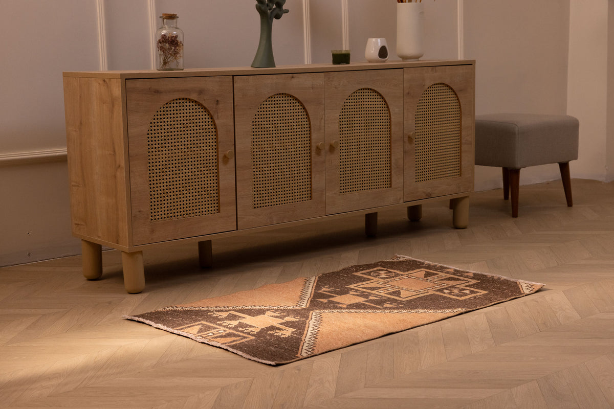 Hand-woven 2x4 ft vintage Turkish wool and cotton doormat with orange and brown geometric patterns.