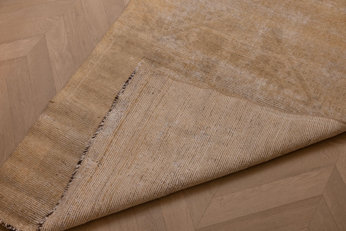 Hand-woven vintage Turkish runner rug in beige and brown wool and cotton with a textured geometric weave.
