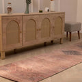 Bohemian 2.7x9.5 ft runner rug in pink and brown wool-cotton blend with geometric Persian-style patterns.