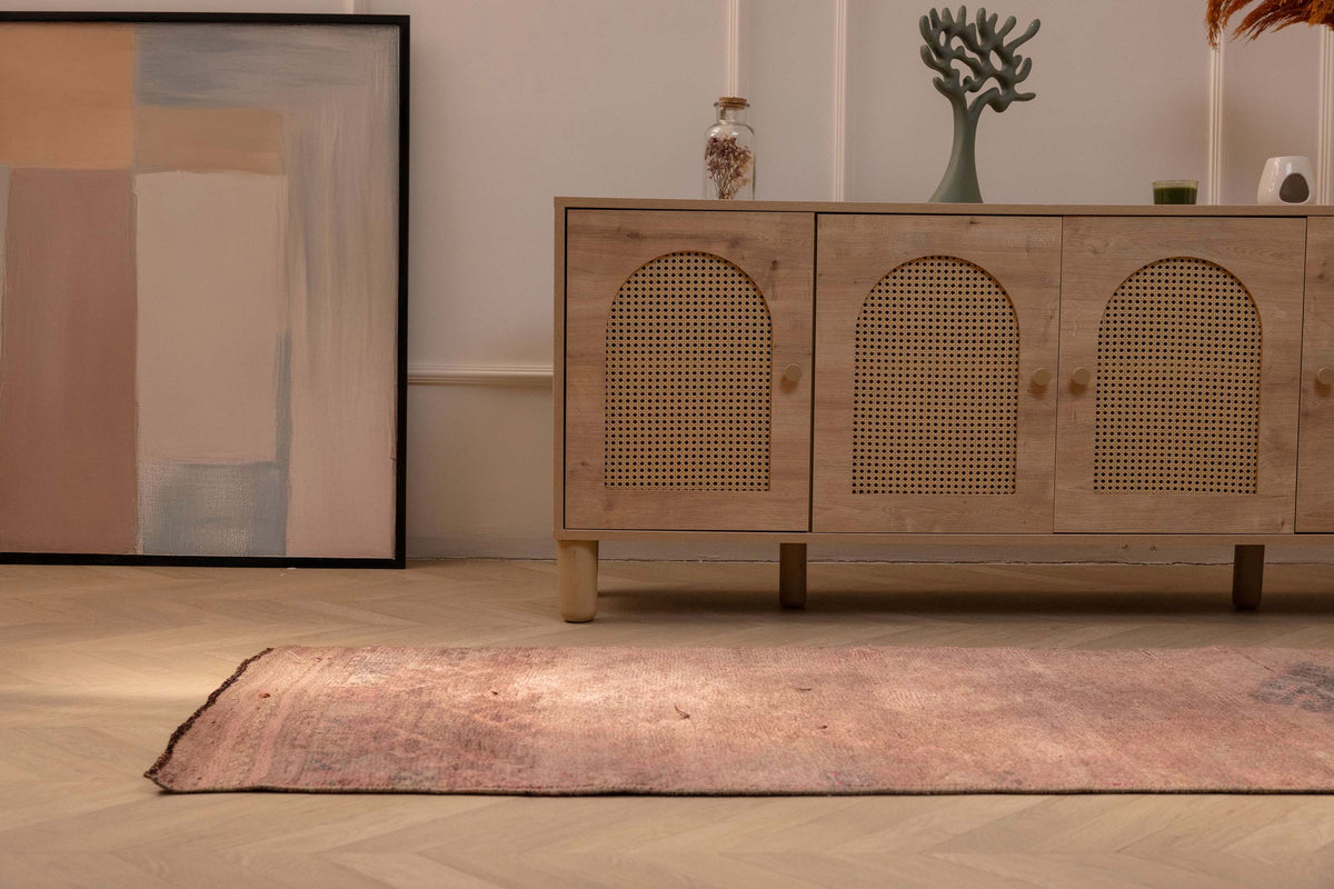 Handmade 2.7x9.5 ft wool and cotton Persian-style runner rug in brown and pink with geometric bohemian patterns.