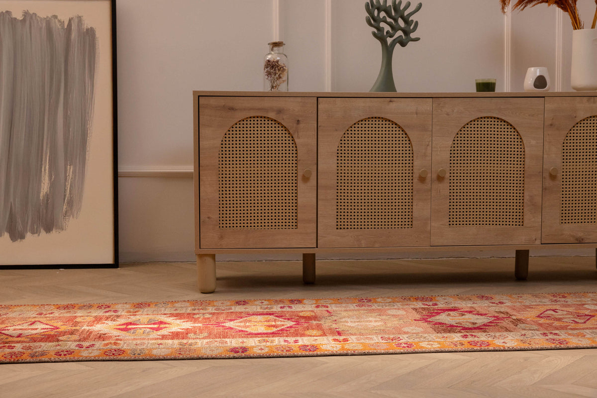 Handmade 2.6x13.5ft Persian-style runner rug in red and orange with maximalist floral patterns in wool and cotton.