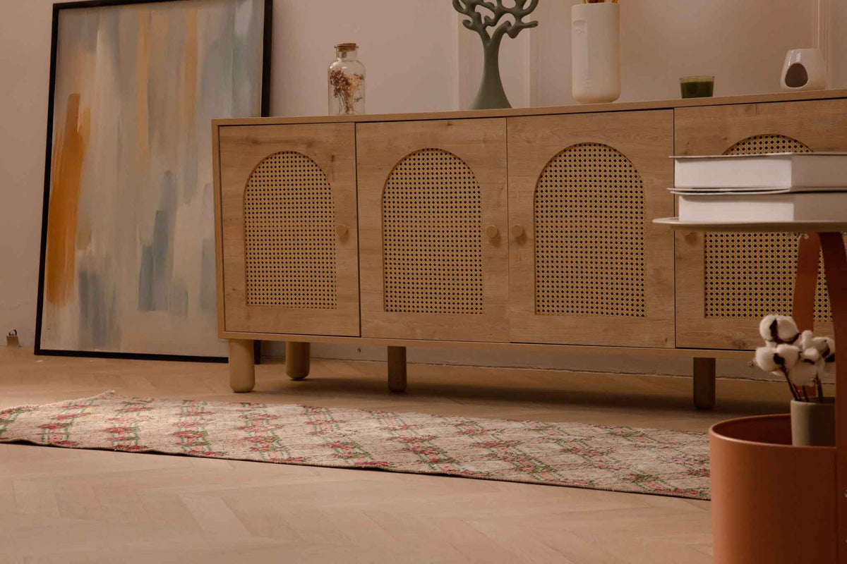 Vintage beige and pink floral Turkish runner rug in wool and cotton, featuring a distressed bohemian design.