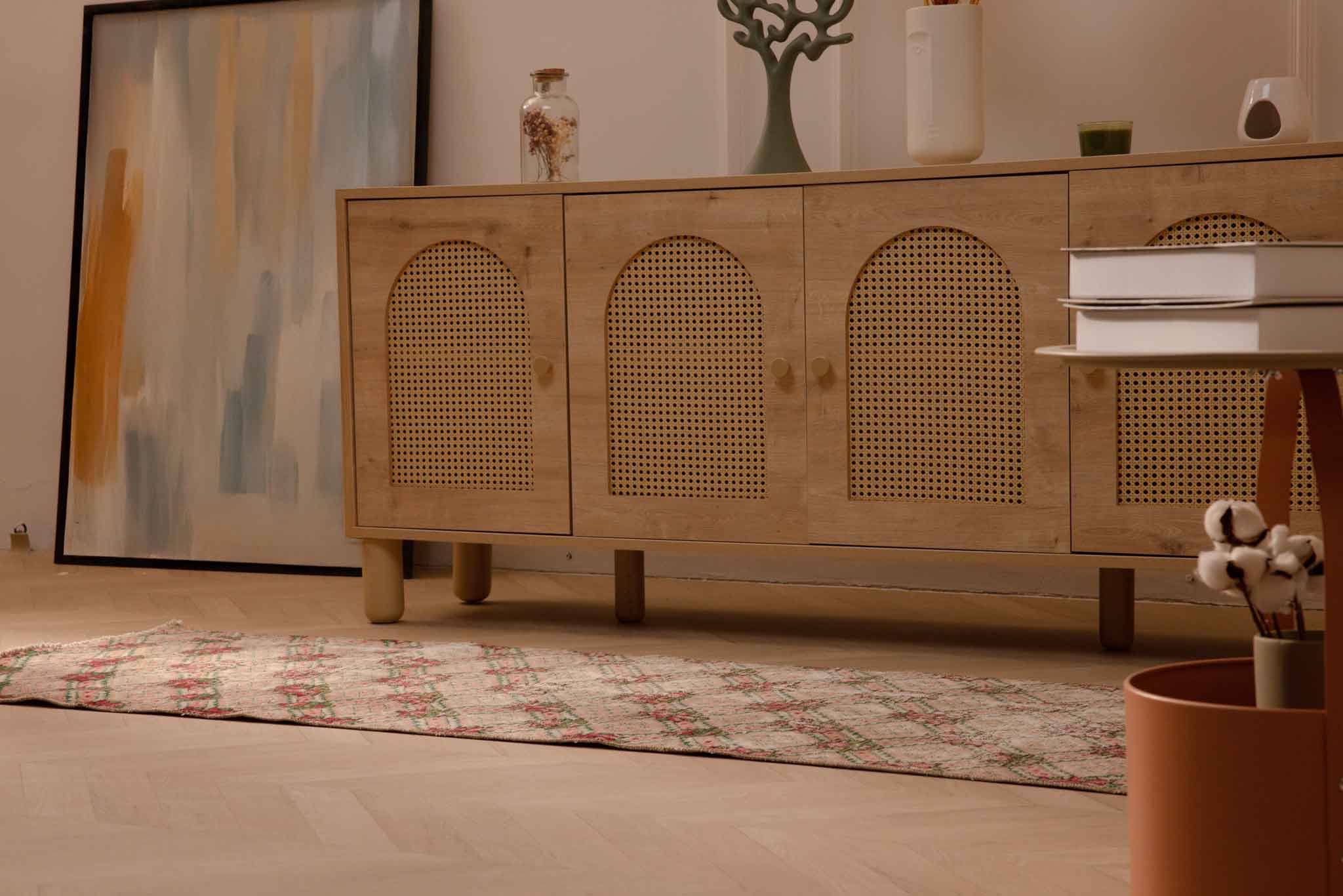 Vintage beige and pink floral Turkish runner rug in wool and cotton, featuring a distressed bohemian design.
