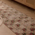Vintage 2.3x8.6 ft beige Turkish runner rug with distressed floral patterns in wool and cotton.