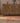 Handmade 2x3 ft vintage Isparta wool and cotton rug featuring red and beige stripes on a wooden floor.