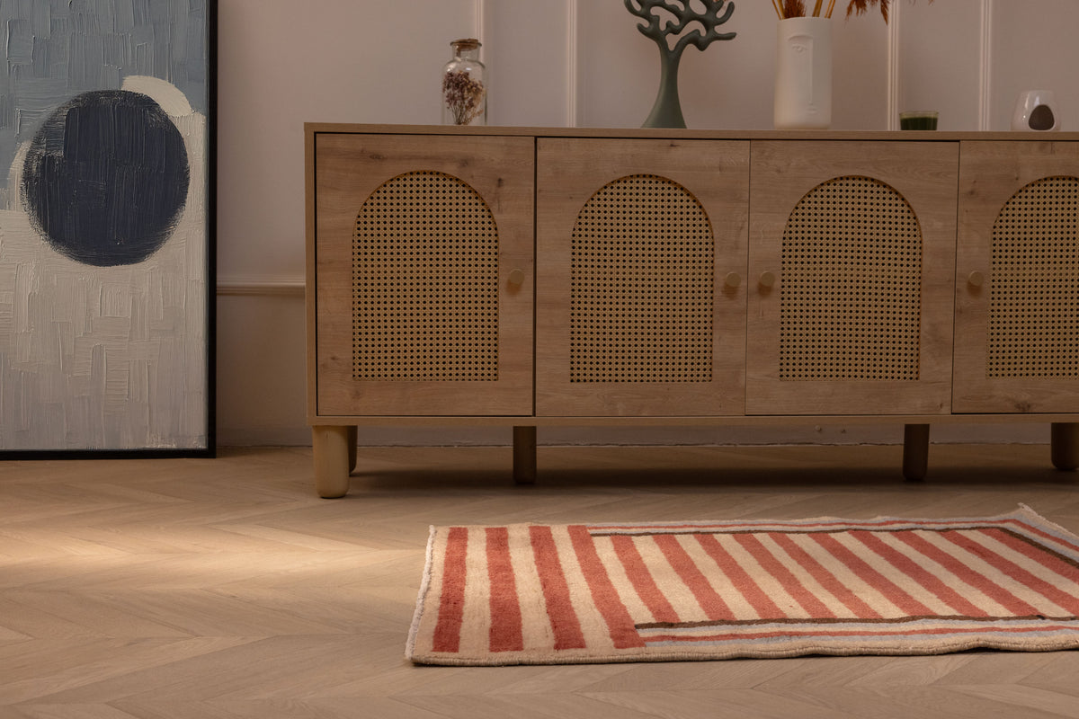 Handmade 2x3 ft vintage Isparta wool and cotton rug featuring red and beige stripes on a wooden floor.