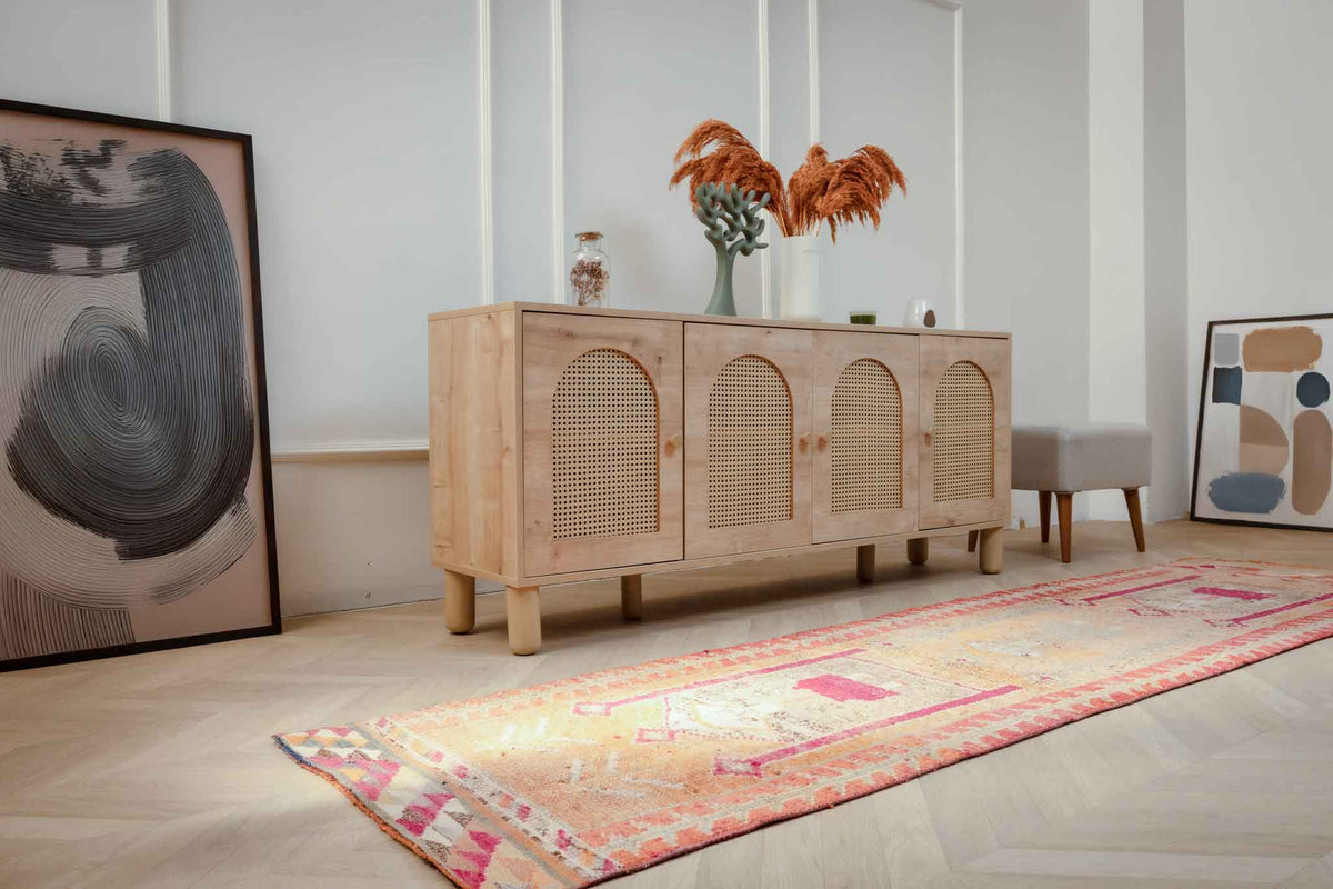 Handmade 2.7x9.9 ft wool and cotton Persian runner rug in orange and yellow with bohemian human-figured patterns.