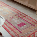 Handmade 2.7x9.9 ft wool and cotton runner rug with orange and yellow bohemian human-figured Persian patterns.