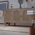 Hand-woven beige vintage Turkish area rug with distressed minimalist patterns on a wooden floor in a modern room.