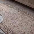 Hand-woven beige vintage Turkish area rug with a distressed minimalist pattern, crafted from wool and cotton.