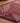 Handmade pink and white wool-cotton runner rug with geometric Bohemian patterns, 2.8 x 9.7 ft, shown on a wooden floor.