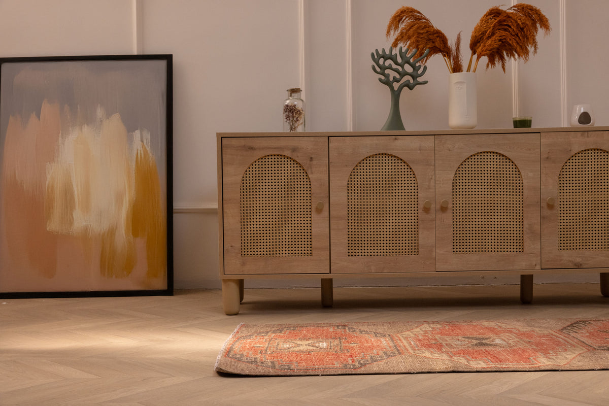 Vintage Malatya Turkish runner rug in burnt orange and brown wool with geometric patterns on a wooden floor.