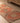 Vintage handmade Turkish runner rug in orange and brown with geometric patterns, crafted from wool and cotton.
