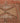 Hand-woven vintage Turkish runner rug in burnt orange and brown with rustic geometric wool and cotton patterns.