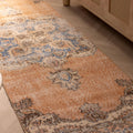 Vintage 2.6x10 ft orange and blue floral Isparta Turkish runner rug in a bohemian wool and cotton weave.