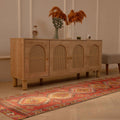 Handmade 2.5x10.5 ft Turkish runner rug in red and brown with geometric patterns, crafted from wool and cotton.