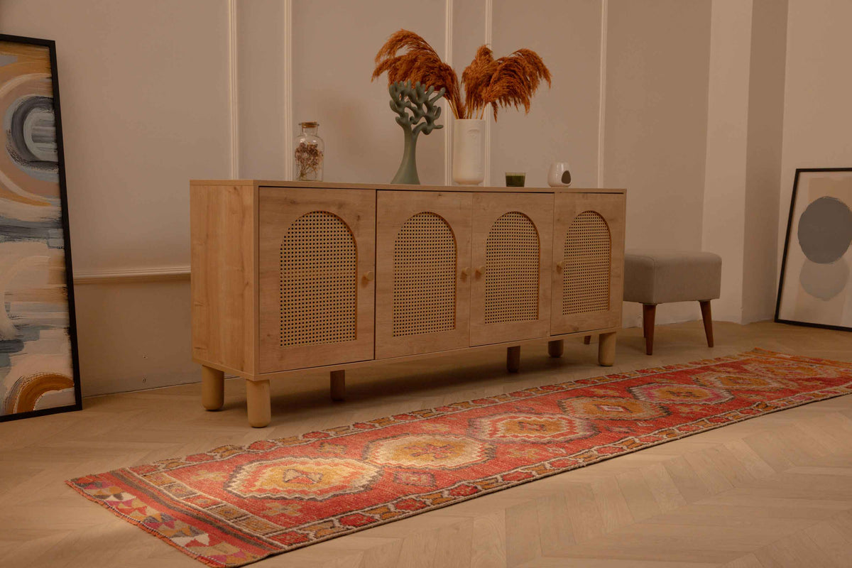 Handmade 2.5x10.5 ft Turkish runner rug in red and brown with geometric patterns, crafted from wool and cotton.