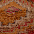 Handmade Turkish runner rug in red and brown with a low-pile wool and cotton blend and intricate geometric bohemian patterns.