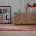 Handmade 2.7x12.6 ft Persian-style runner rug in pink and brown wool-cotton blend with maximalist floral patterns.
