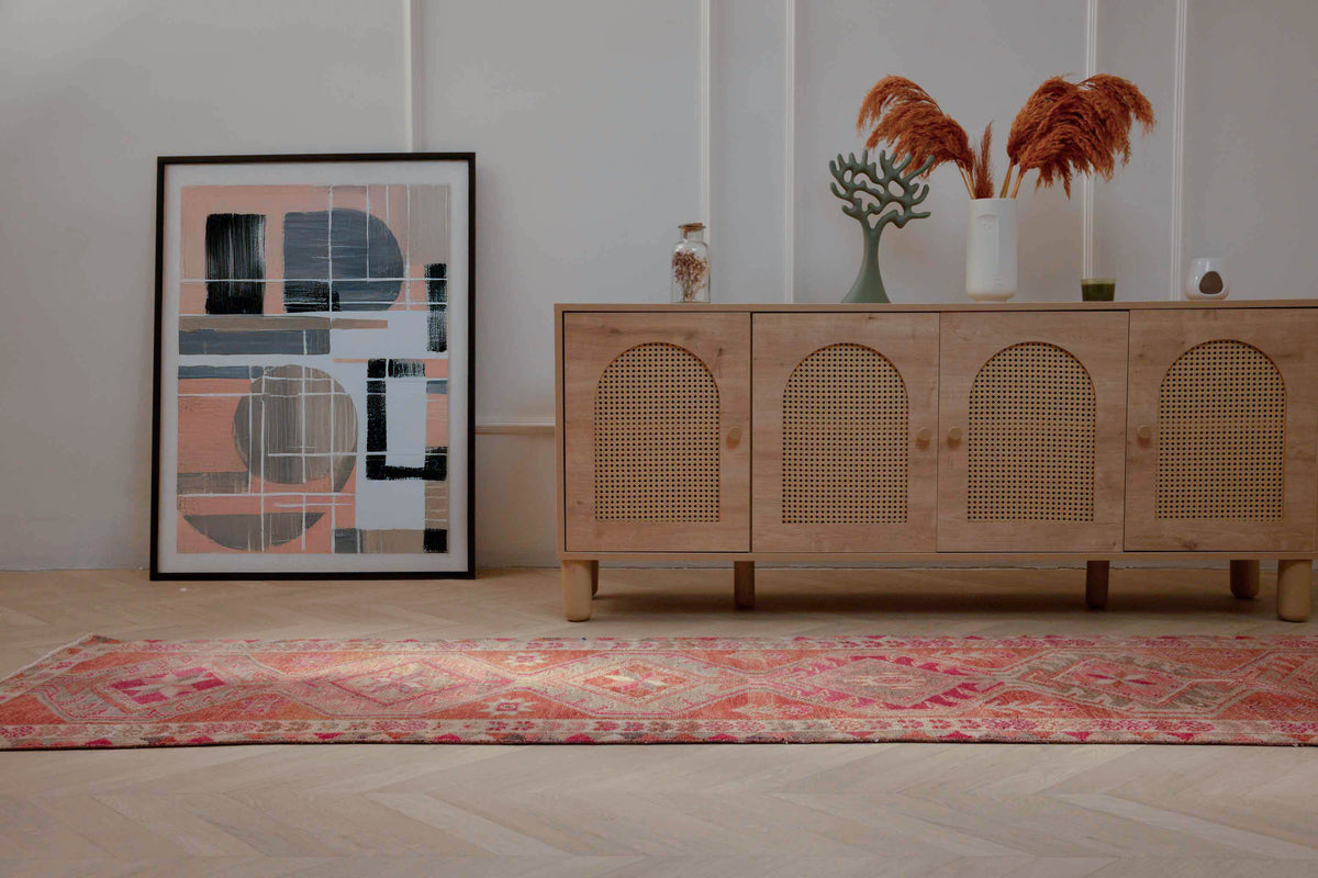 Handmade 2.7x12.6 ft Persian-style runner rug in pink and brown wool-cotton blend with maximalist floral patterns.
