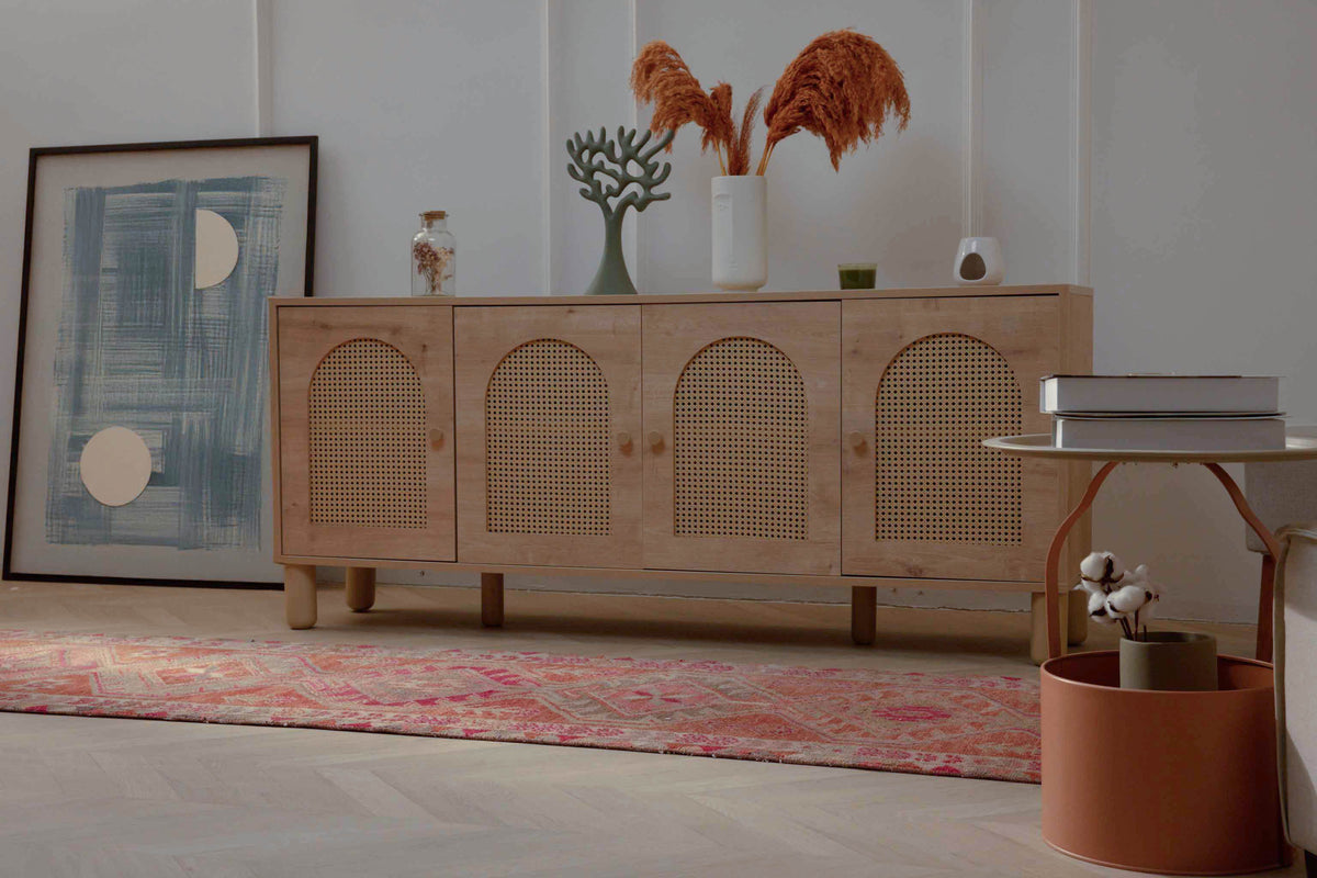 Handmade Persian-style wool and cotton runner rug in pink and brown with a floral maximalist pattern.