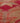 Close-up of a handmade wool and cotton Persian-style runner rug featuring a bohemian floral pattern in pink and brown.