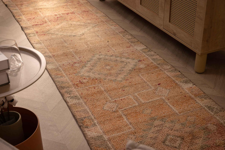 Handmade 2.7x11.6 ft orange Persian-style runner rug with geometric patterns in a wool and cotton low-pile blend.