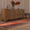 Vintage Persian-style runner rug in orange and navy with a floral pattern, handmade from wool and cotton, 3.4 x 13 ft.