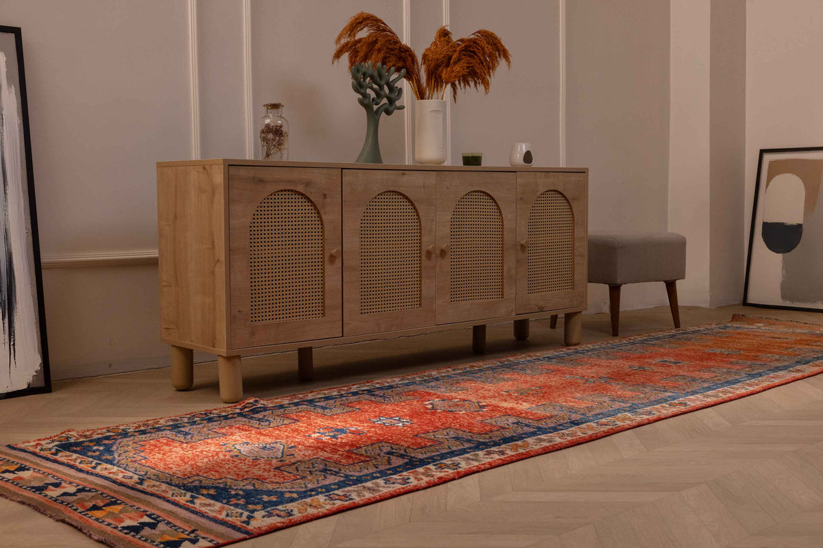Vintage Persian-style runner rug in orange and navy with a floral pattern, handmade from wool and cotton, 3.4 x 13 ft.