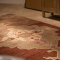 Hand-woven vintage Kars Turkish area rug in brown with geometric patterns, crafted from wool and cotton in a 5x9 ft size.