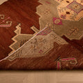Hand-woven 5x9 ft vintage Kars Turkish rug in brown wool and cotton with intricate geometric patterns.