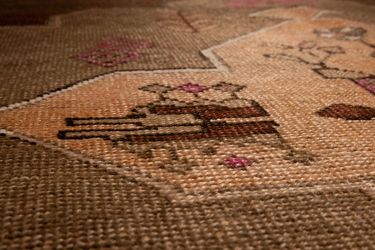 Hand-woven vintage Kars Turkish area rug in brown with geometric patterns, crafted from wool and cotton in a low pile.