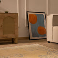 Hand-woven vintage Manisa Turkish rug in yellow and blue floral wool and cotton, 4x8 ft, styled in a modern living room.