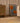 Hand-woven vintage Manisa Turkish rug in yellow and blue floral wool and cotton, 4x8 ft, styled in a modern living room.